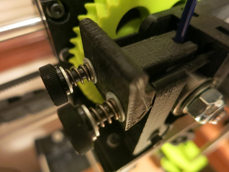 The two screws that adjust extruder tension