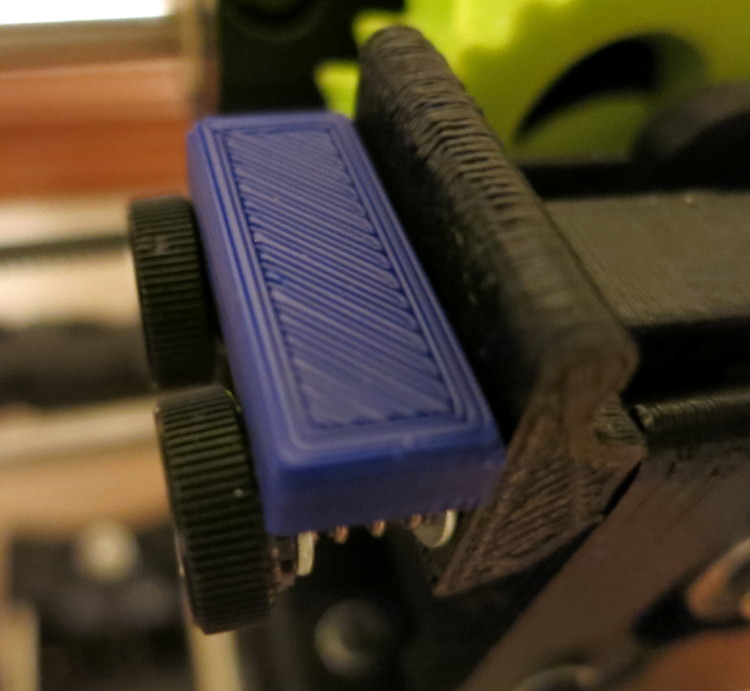 Using a calibrated block to set the extruder tension