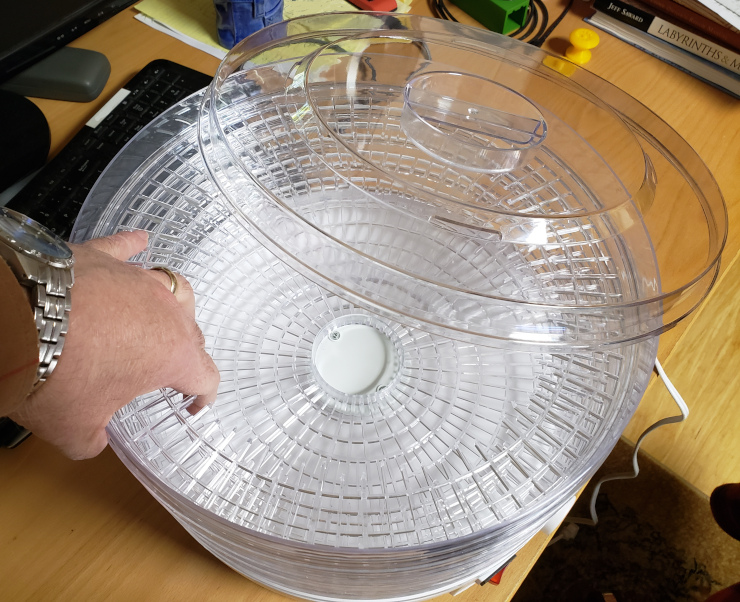 The assembled dehydrator, with an un-cut tray on the bottom