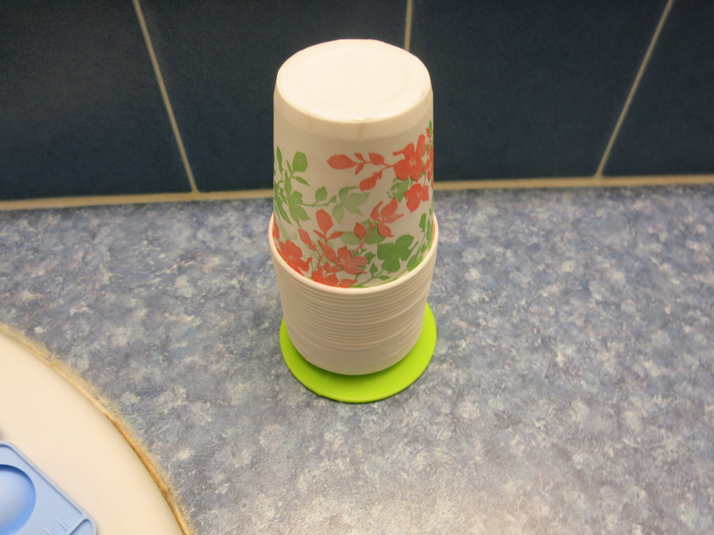 The finished paper cup stand by the sink