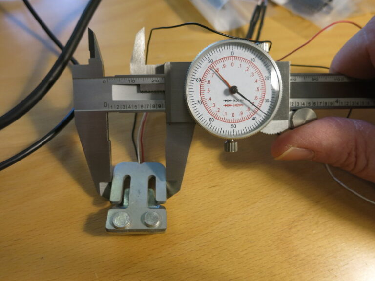 Measuring a load sensor using a caliper
