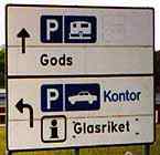 The road sign saying "gods" near the glass works