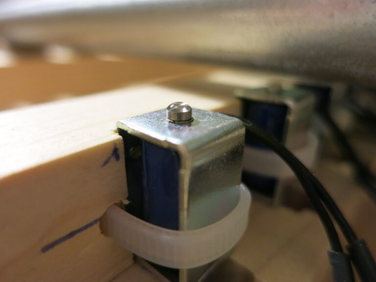 A daub of silicone on a solenoid. The silicone is about 2x as deep as it needs to be.