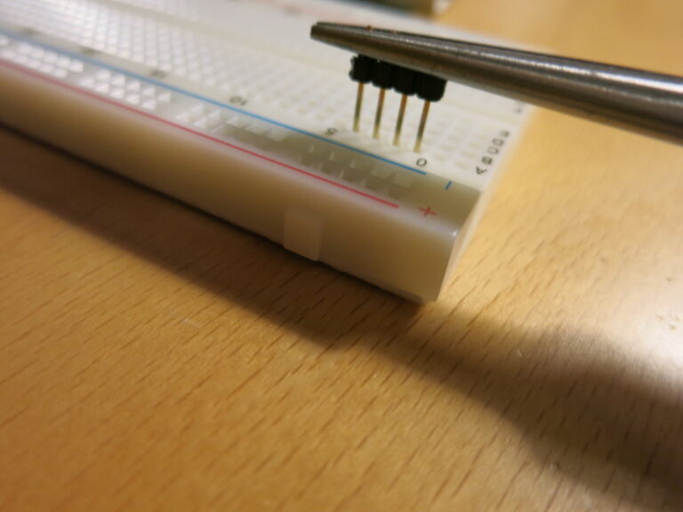 Ready to press the plastic part down to the surface of the breadboard