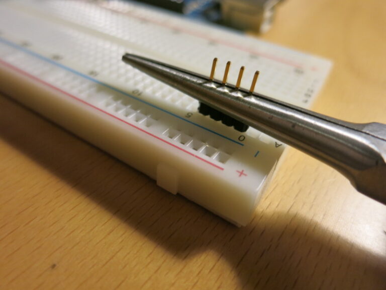 I’ve used the pliers to press the plastic part down to the level of the breadboard