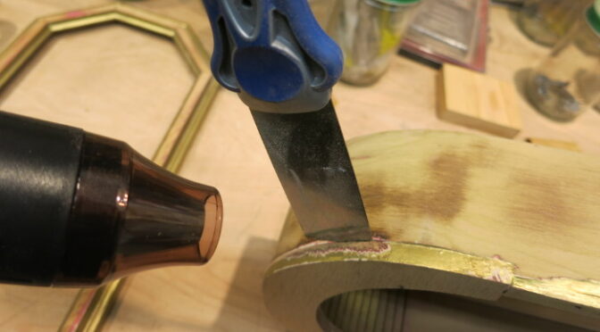 Loosening antique Hide Glue with a heat gun and spatula