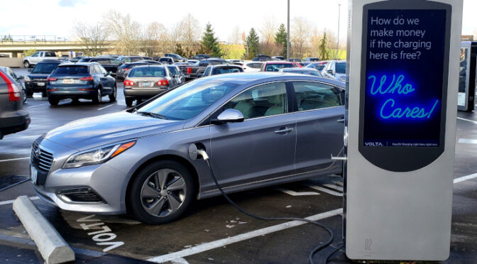 An Electric Vehicle plugged into a Volta charger.