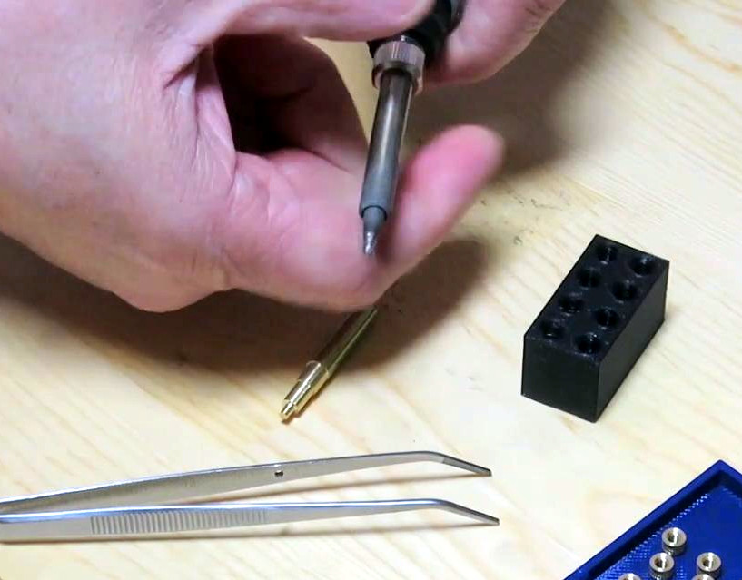 Unscrewing the soldering iron tip holder