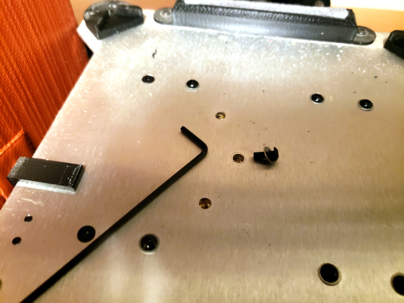 After removing the print bed I could easy unscrew the bolts that held the Y axis belt mount in place