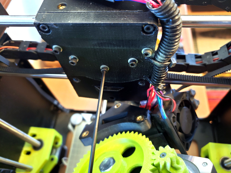 After removing the print head I could unscrew the bolts that held the X axis belt mount in place