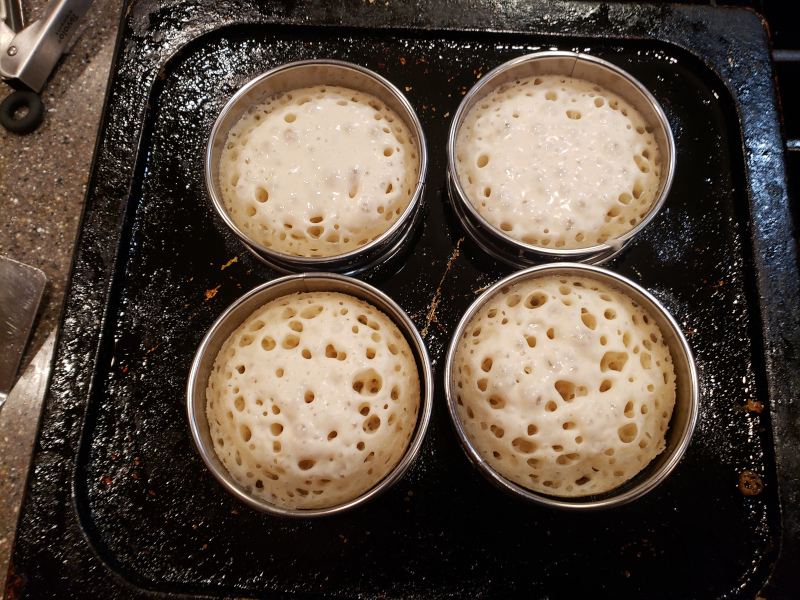 Note the batter pulling away from some of the rings, and the drying crumpet tops